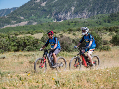 optibike-r17-casual-2-bikes Optibike R17 E-Bikes riding together on a dirt trail