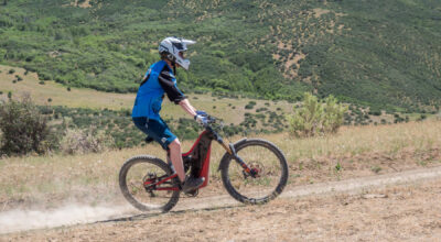 optibike-r17-slide-side Optibike R17 E-Bike skidding around a turn on a dirt road